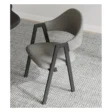 stylish grey upholstered chair with black wooden frame