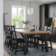 Modern 6-seater wooden dining set in Pakistan with black dining chairs and natural wood table, perfect for contemporary dining rooms and stylish home interiors