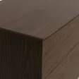 Oslo Side Table – close-up view showing smooth closed edge and detailed wood grain texture on the brown wooden surface.