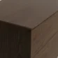 Oslo Side Table – close-up view showing smooth closed edge and detailed wood grain texture on the brown wooden surface.