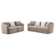 Pair of soft beige loveseats with contrasting light cushions displayed on white background.