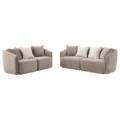 Pair of soft beige loveseats with contrasting light cushions displayed on white background.