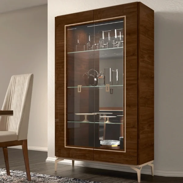 Veneer Dining Cabinet Styled dining room scene featuring a wood-veneer glass display cabinet filled with glassware.