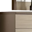 Detail of top corner showing taupe side panel and ribbed cream drawer texture near mirror.