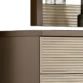 Detail of top corner showing taupe side panel and ribbed cream drawer texture near mirror.