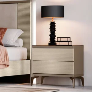 Verona Side Table (2) Verona Side Table with ribbed cream drawers, slim metal legs and dark top beside bed with lamp