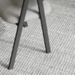 dining chair showing black thin wooden legs