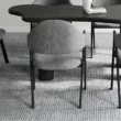 Upholstered dining chair showing back upholstery.