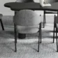 Upholstered dining chair showing back upholstery.