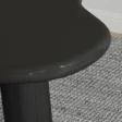 close view of black round dedge of table.