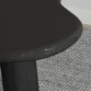 close view of black round dedge of table.