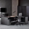 obsadian executive desk in modern office with matching chair.