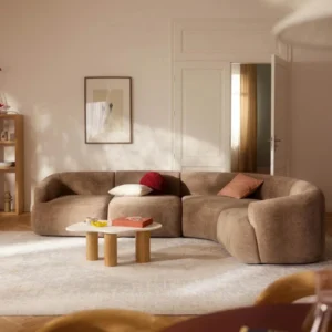 Oro cloud Sectional sofa – 4 seater (Light Brown) Light brown Oro Cloud Sectional Sofa in a modern living room with curved design.