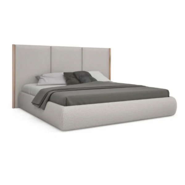 angled view of roco upholstered bed in light grey