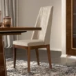 cream and walnut dining chair in dining room