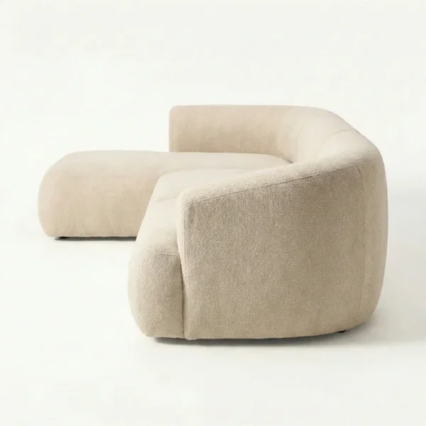 Arista Curve Modular sofa - Light Grey (8)_ Side profile view of beige modular sofa