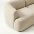 armrest close view of beige sofa