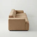 side profile view of light brown modular sofa.