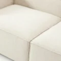close view of seat showing premium fabric upholstery of white sofa
