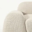 close view of side armrest of white sofa
