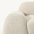 close view of side armrest of white sofa