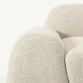 close view of side armrest of white sofa