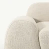 close view of side armrest of white sofa