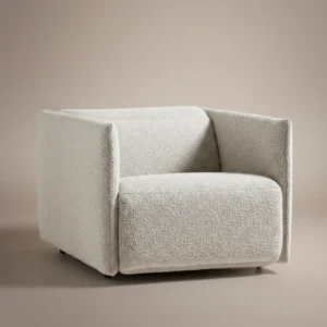 aircush offwhite upholstered armchair in studio background