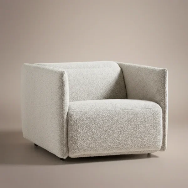 aircush offwhite upholstered armchair in studio background