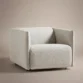 aircush offwhite upholstered armchair in studio background