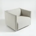 upper angled view of off white upholstered chair
