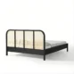reaer view of black cane bed