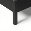 close view showing black bed leg