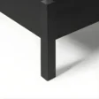 close view showing black bed leg