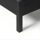 close view showing black bed leg