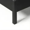 close view showing black bed leg