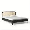 angled view of black cane bed