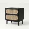 angled view of black cane side table