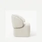 side profile view of white boucle armchair
