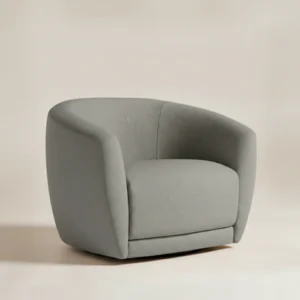 grey upholstered chair in studio background
