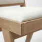 seat close edge view showing wood material and fabric upholstery