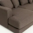 armrest and seat close view of brown sectional sofa