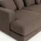 armrest and seat close view of brown sectional sofa