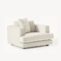 angled view of white soft fabric chair