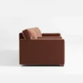 side profile view of brick red 3 seter sofa