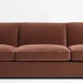 seats close view of brick red 3 seter sofa