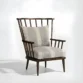 angled view of wooden chair in seat and back cushion
