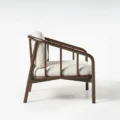 Side profile view of wooden accent chair