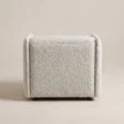 Back view of the AirCush armchair with fully upholstered off-white exterior