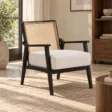 Cane Sculpt Armchair with white seat and natural cane back styled in a contemporary living room